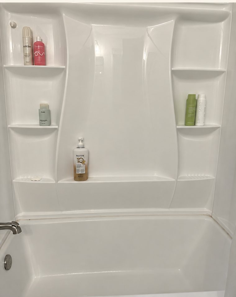 The same shower after a Pure Nest steam clean, bright and spotless